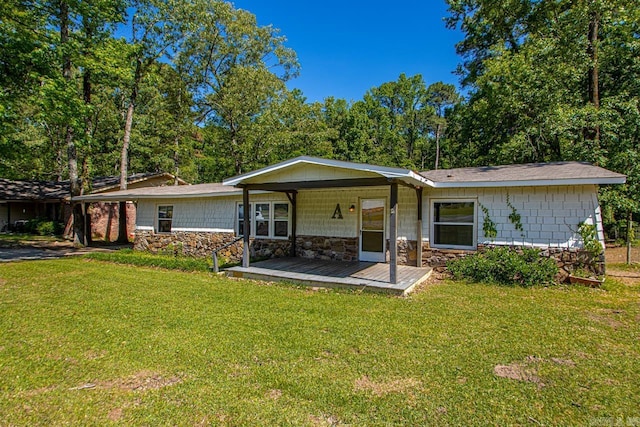 1504 W Woodson Lateral Rd, Hensley, AR 72065 - rear view of property with stone siding, a yard, and a porch