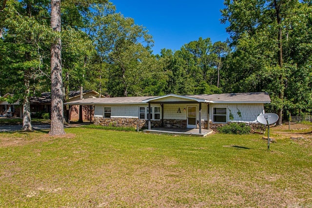 1504 W Woodson Lateral Rd, Hensley, AR 72065 - view of front facade featuring stone siding, a porch, and a front yard