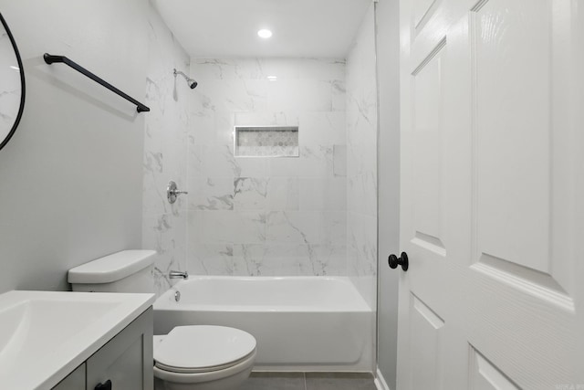 full bath featuring vanity, toilet,  shower combination, and tile patterned flooring