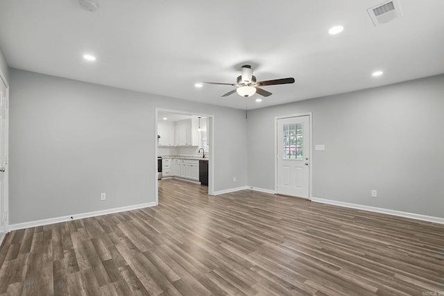 unfurnished living room with recessed lighting, baseboards, visible vents, ceiling fan, and wood finished floors