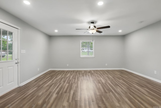 spare room featuring a ceiling fan, baseboards, recessed lighting, and wood finished floors