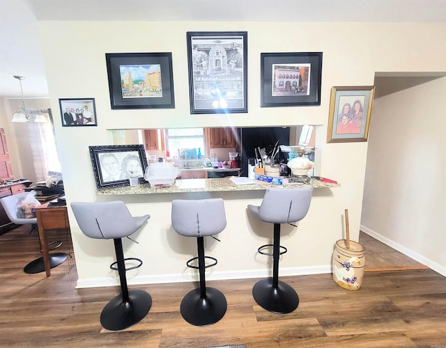 301 Hammond Unit A3, Hot Springs, AR 71913 - bar with baseboards and wood finished floors