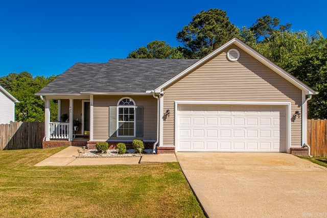 view of front facade with fence, an attached garage, concrete driveway, a front yard, and a porch