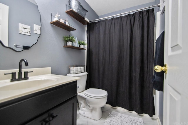 full bath featuring toilet and vanity