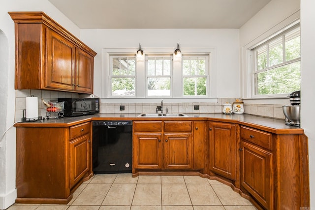 2420 Marshall St, Little Rock, AR 72206 - kitchen featuring brown cabinetry, light tile patterned flooring, a sink, backsplash, and black appliances