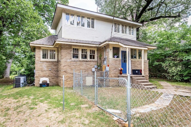 2420 Marshall St, Little Rock, AR 72206 - view of front of house featuring a fenced front yard, a front lawn, and brick siding