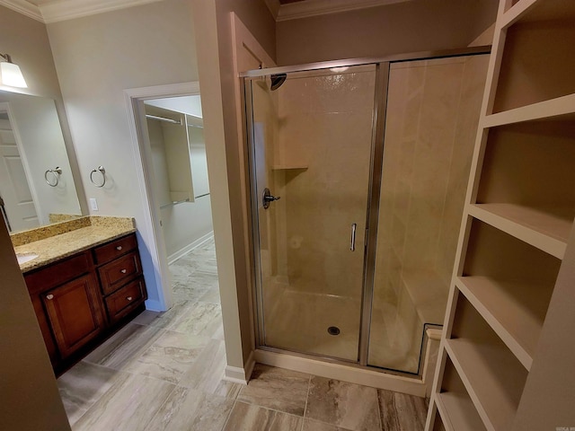 244 Mountain Terrace Cir, Maumelle, AR 72113 - bathroom with crown molding, a stall shower, vanity, and a walk in closet
