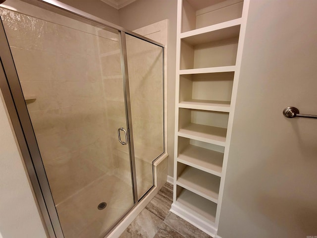 244 Mountain Terrace Cir, Maumelle, AR 72113 - bathroom with a shower stall, built in shelves, and a walk in closet