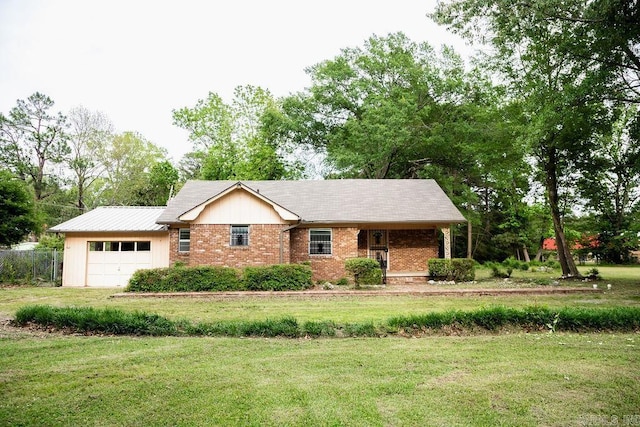 3801 S Hazel, Pine Bluff, AR 71603 - single story home with a front lawn, brick siding, and a garage