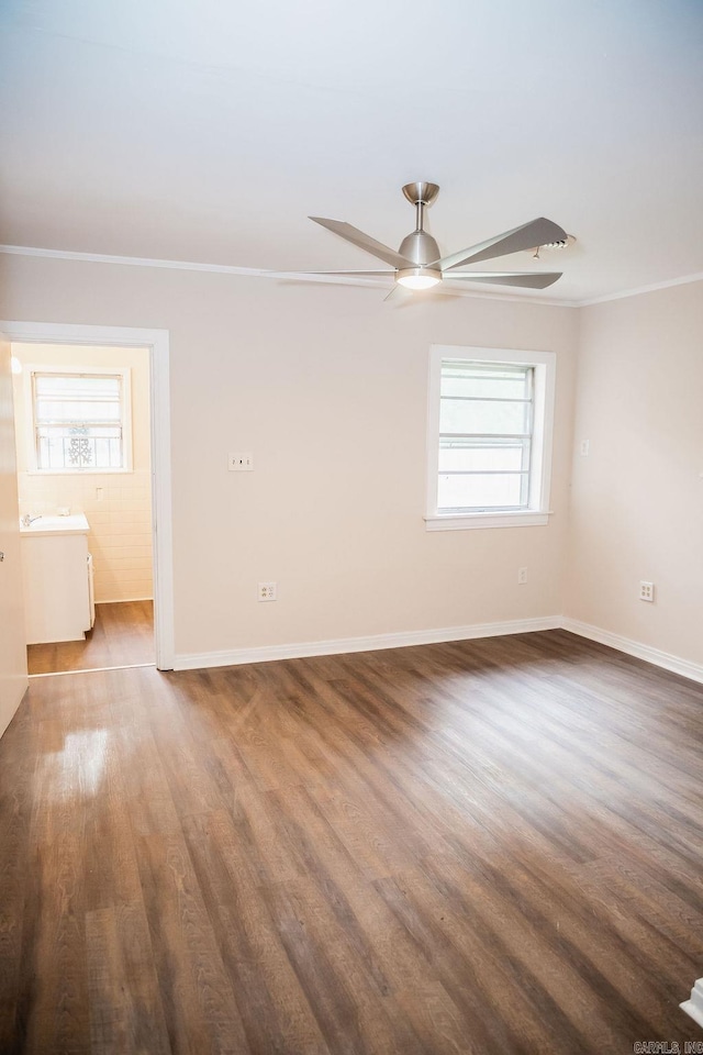 3801 S Hazel, Pine Bluff, AR 71603 - unfurnished room featuring ornamental molding, wood finished floors, and a healthy amount of sunlight