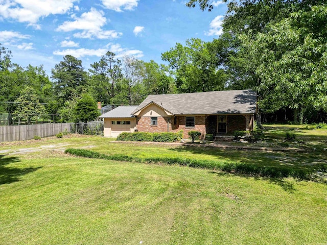 3801 S Hazel, Pine Bluff, AR 71603 - ranch-style home featuring a front yard, brick siding, and fence