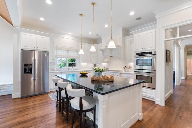 kitchen with white cabinetry, stainless steel appliances, tasteful backsplash, and dark wood-style floors