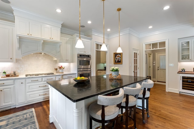 kitchen featuring wine cooler, white cabinetry, appliances with stainless steel finishes, and dark wood-style floors