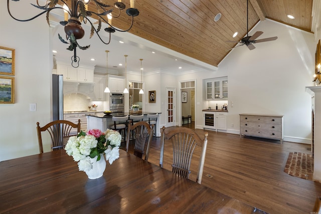 dining room with dark wood finished floors, ceiling fan with notable chandelier, recessed lighting, and beverage cooler