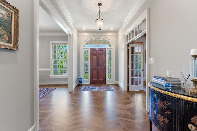 foyer entrance featuring baseboards, ornamental molding, and recessed lighting
