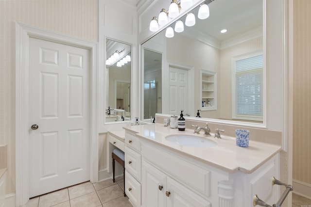 bathroom featuring wallpapered walls, tile patterned floors, crown molding, built in features, and vanity