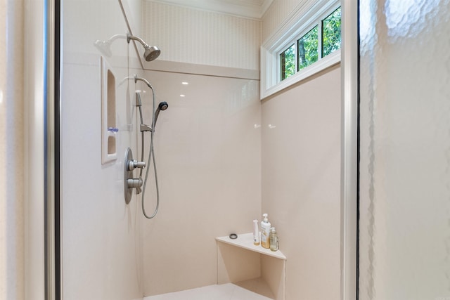 full bathroom with walk in shower and crown molding