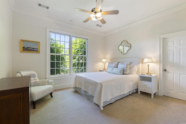 bedroom featuring light colored carpet, ornamental molding, and visible vents