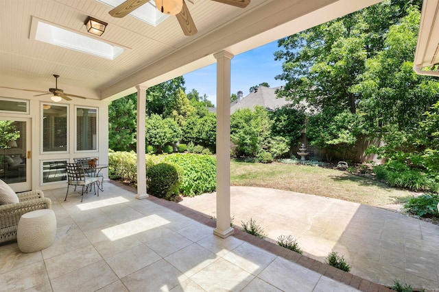 view of patio with fence and a ceiling fan