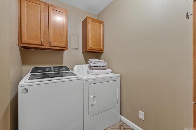 720 N 18th St, Blytheville, AR 72315 - laundry area featuring washer and dryer and cabinet space
