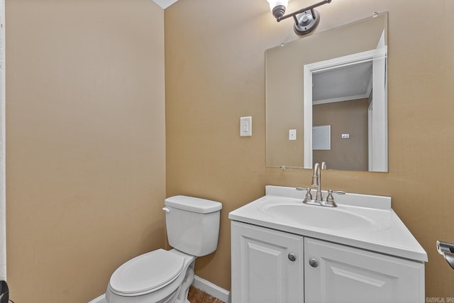 720 N 18th St, Blytheville, AR 72315 - bathroom with toilet, baseboards, and vanity