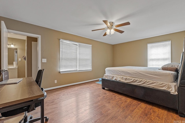 720 N 18th St, Blytheville, AR 72315 - bedroom with wood finished floors, baseboards, and ceiling fan