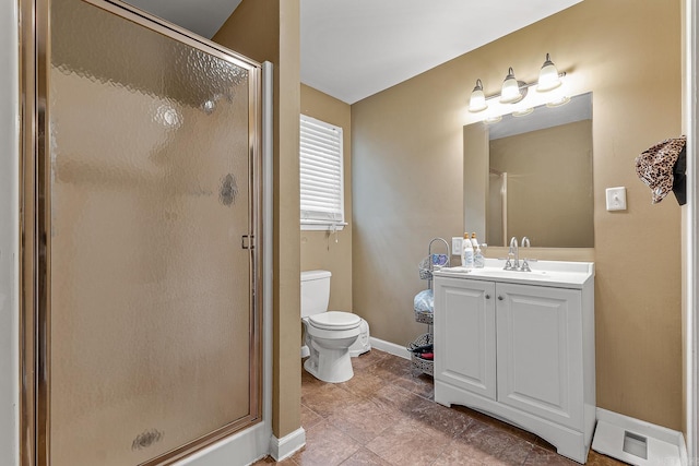 720 N 18th St, Blytheville, AR 72315 - full bathroom with a stall shower, vanity, toilet, and baseboards