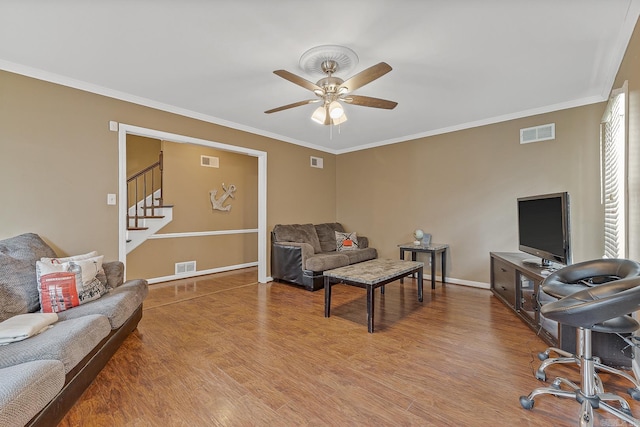 720 N 18th St, Blytheville, AR 72315 - living room with a ceiling fan, visible vents, and wood finished floors