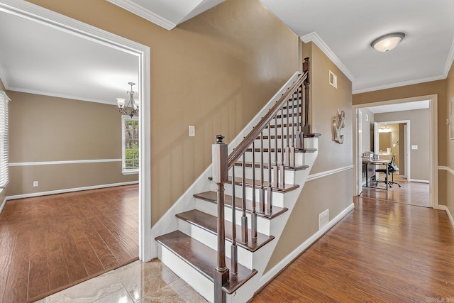720 N 18th St, Blytheville, AR 72315 - stairs with an inviting chandelier, visible vents, and ornamental molding