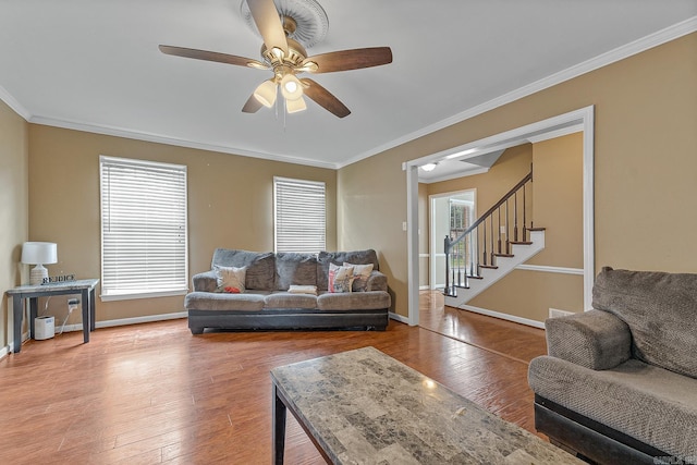 720 N 18th St, Blytheville, AR 72315 - living room featuring crown molding, stairway, and hardwood / wood-style flooring