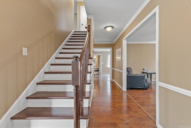 720 N 18th St, Blytheville, AR 72315 - stairway with crown molding, wood finished floors, and baseboards