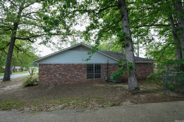 view of home's exterior with brick siding