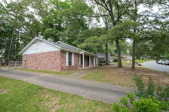 view of property exterior with brick siding