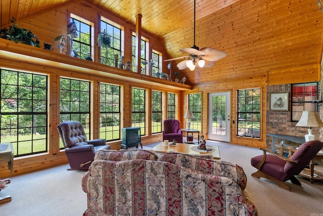 1000 Grandview Heights Dr, Conway, AR 72032 - carpeted living area featuring high vaulted ceiling, wood ceiling, wood walls, and ceiling fan
