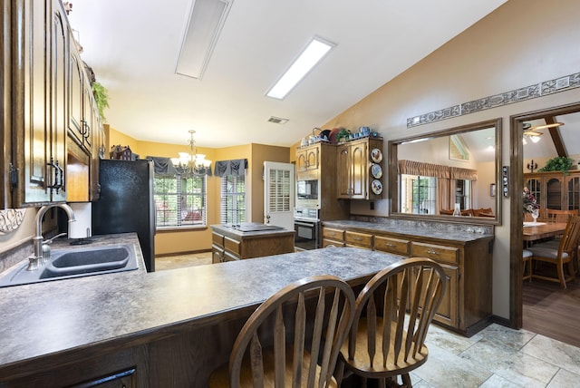 1000 Grandview Heights Dr, Conway, AR 72032 - kitchen with a sink, black appliances, vaulted ceiling, a center island, and a peninsula