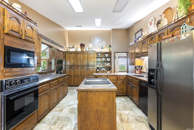 1000 Grandview Heights Dr, Conway, AR 72032 - kitchen with black appliances, a sink, a center island, and healthy amount of natural light