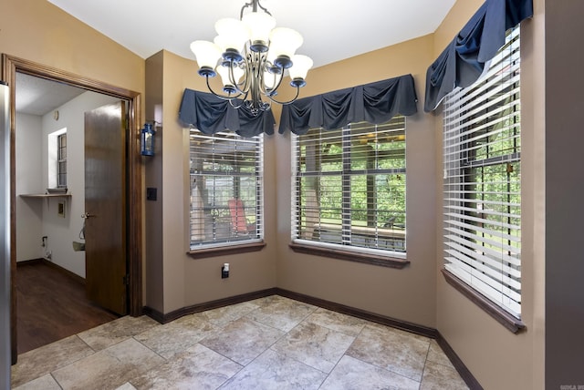 1000 Grandview Heights Dr, Conway, AR 72032 - unfurnished dining area with a chandelier and baseboards
