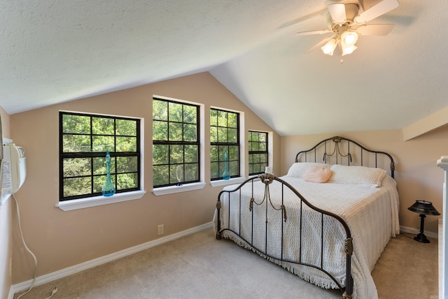 1000 Grandview Heights Dr, Conway, AR 72032 - carpeted bedroom with vaulted ceiling, baseboards, ceiling fan, and a textured ceiling