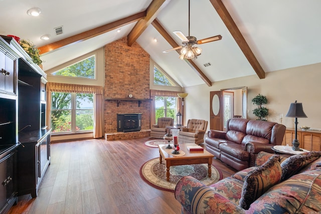 1000 Grandview Heights Dr, Conway, AR 72032 - living area with high vaulted ceiling, beamed ceiling, ceiling fan, a fireplace, and wood finished floors