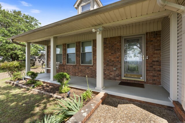 1000 Grandview Heights Dr, Conway, AR 72032 - doorway to property featuring covered porch and brick siding