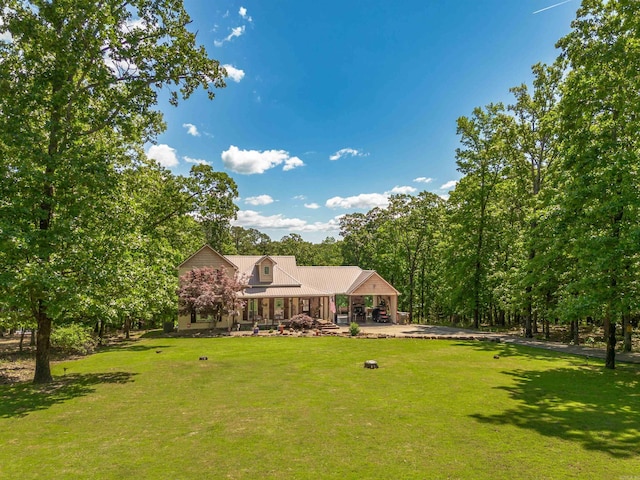 back of property featuring a lawn, a gazebo, and covered porch