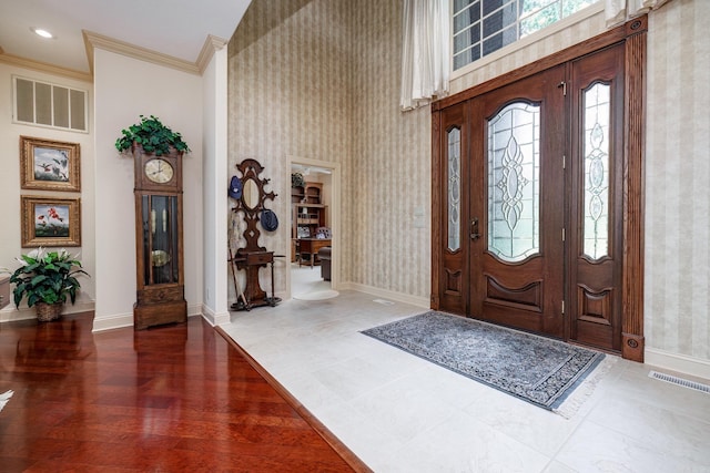 12 Loyola Ln, Hot Springs Village, AR 71909 - foyer entrance featuring wallpapered walls, baseboards, crown molding, and a high ceiling