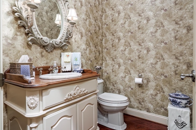 12 Loyola Ln, Hot Springs Village, AR 71909 - half bath featuring toilet, baseboards, wood finished floors, and vanity