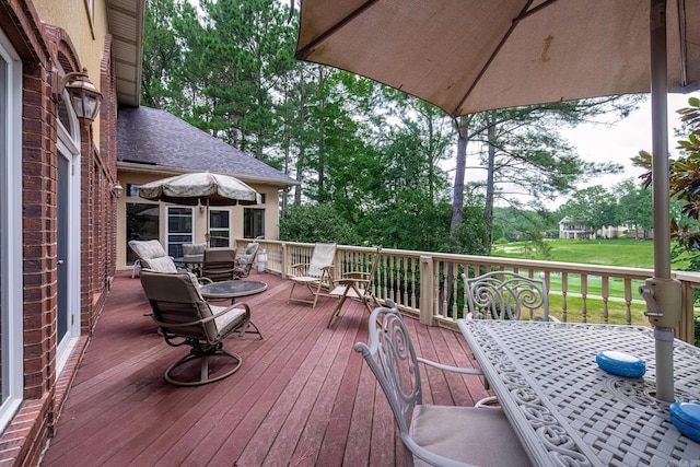 12 Loyola Ln, Hot Springs Village, AR 71909 - wooden deck with outdoor dining area