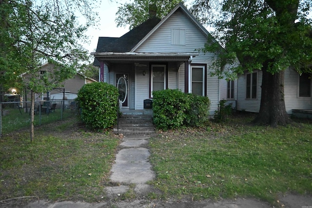 1304 W 9th St, North Little Rock, AR 72114 - bungalow-style house with a porch and a chimney