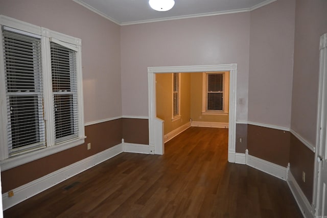 1304 W 9th St, North Little Rock, AR 72114 - empty room featuring wood finished floors, baseboards, and ornamental molding