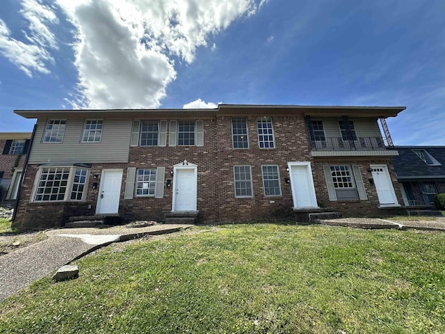 1720 Sanford Dr, Little Rock, AR 72227 - view of front of house featuring a front yard and brick siding