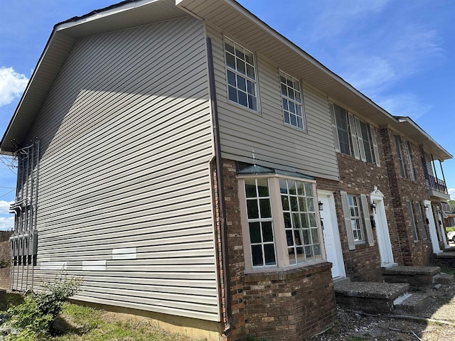 1720 Sanford Dr, Little Rock, AR 72227 - view of side of property with brick siding