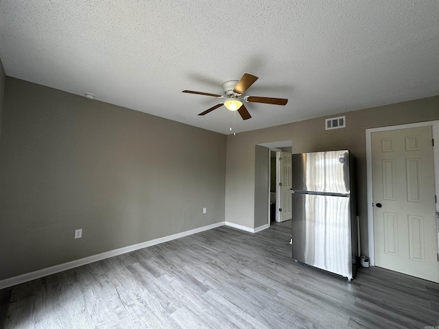 1720 Sanford Dr, Little Rock, AR 72227 - empty room with a ceiling fan, wood finished floors, baseboards, and a textured ceiling