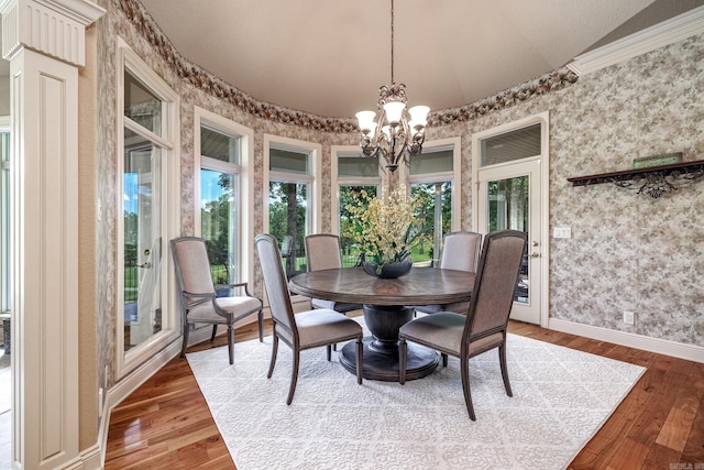 5 Granada Ln, Hot Springs Village, AR 71909 - dining space with wallpapered walls, a chandelier, baseboards, wood finished floors, and ornamental molding
